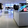 HYPERVSN 3D holographic display showcasing promotional sneakers in clothing store