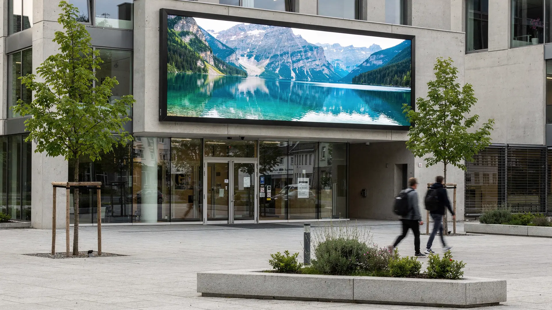 Outdoor LED screen on the façade above the entrance of a company site