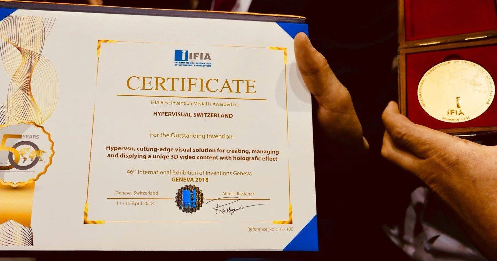 The IFIA certificate awarding the IFIA Best Invention Medal to HYPERVISUAL SWITZERLAND, Geneva 2018, reference 18-105, next to the IFIA gold medal in its case