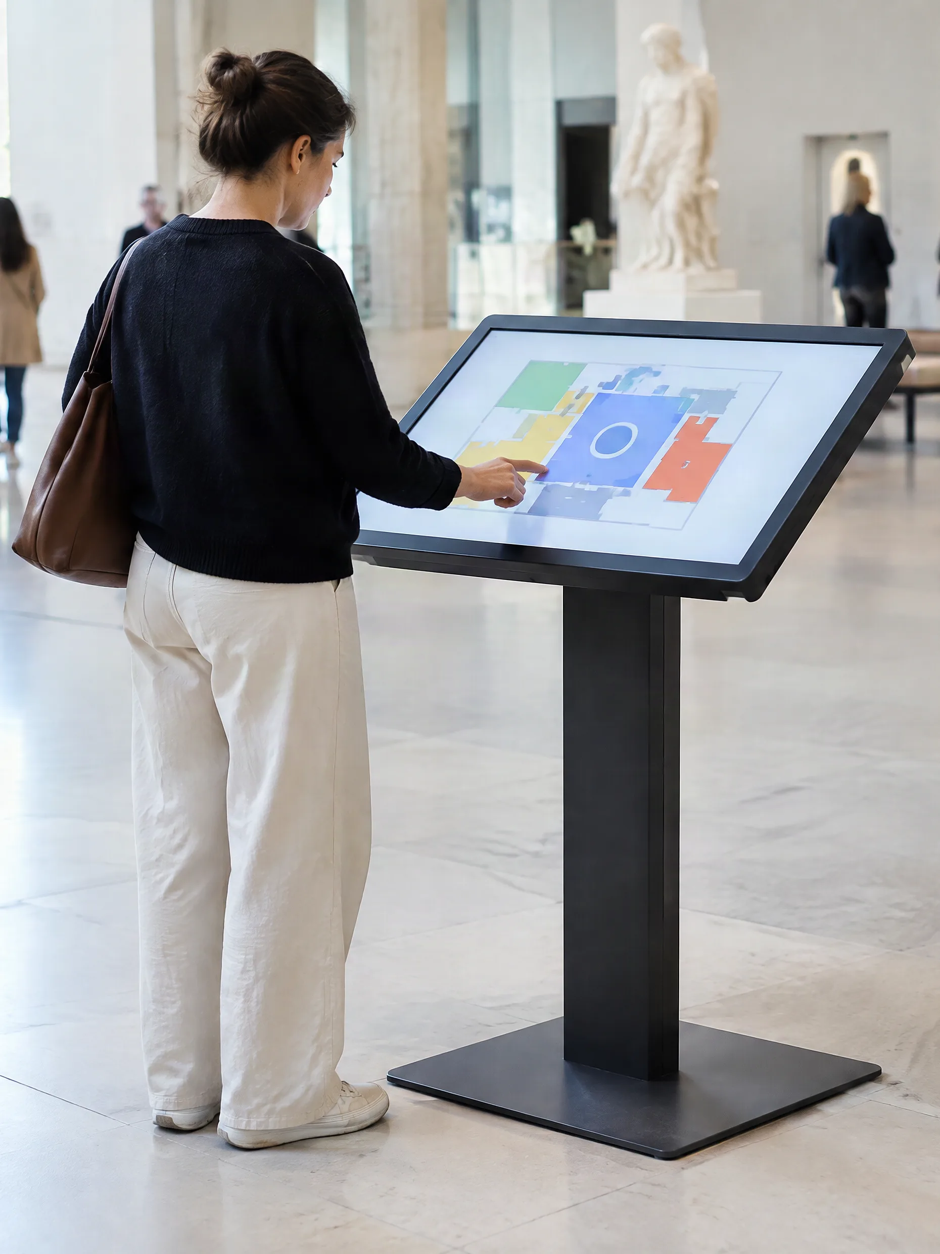 Touchscreen kiosk in a museum showing an interactive map