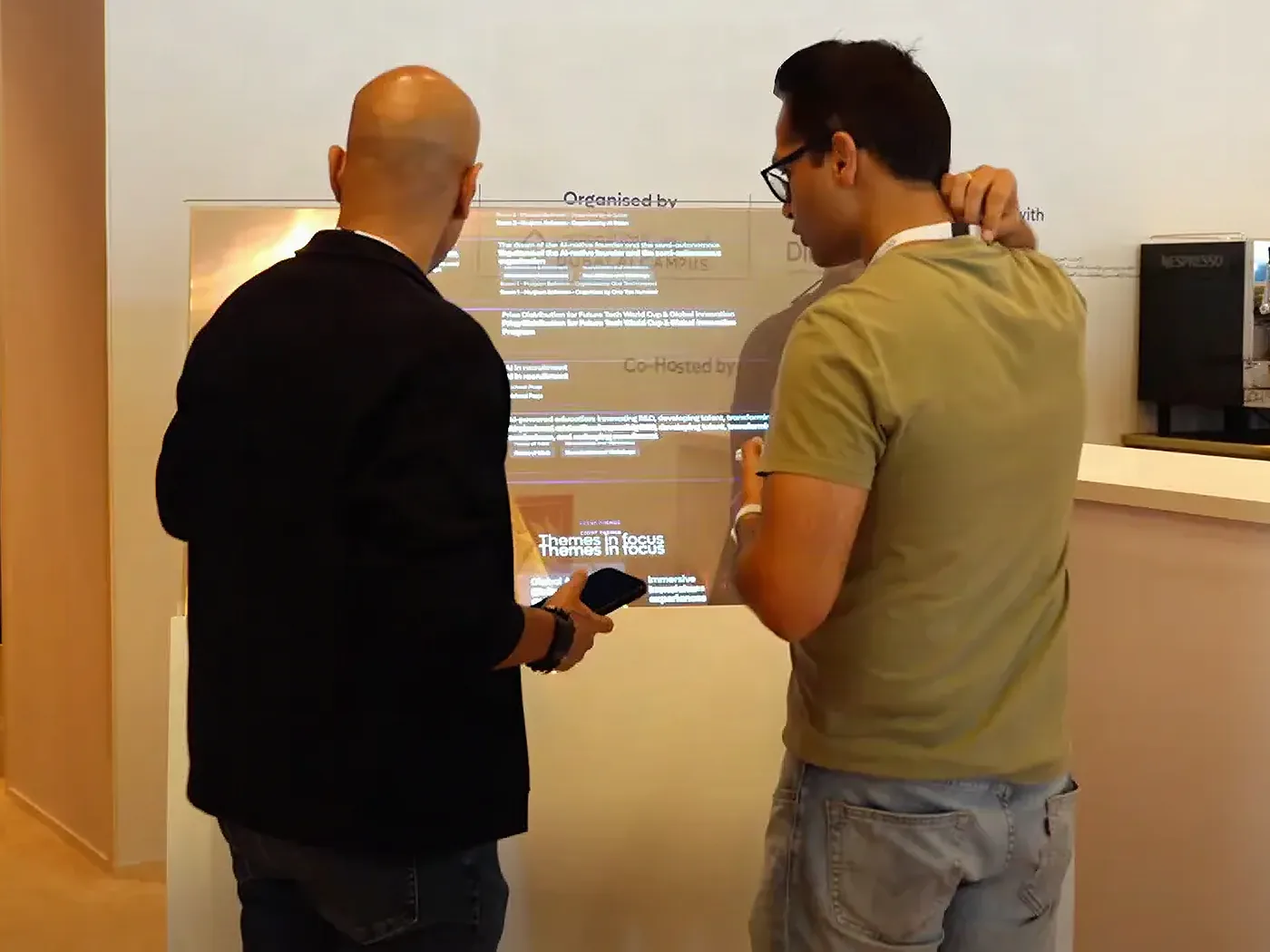 Visitor using a transparent self-service kiosk with a payment terminal
