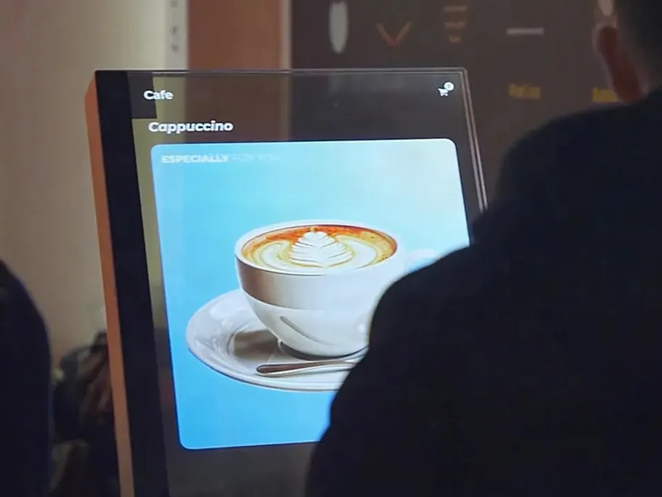 Transparent self-service kiosk with a payment terminal